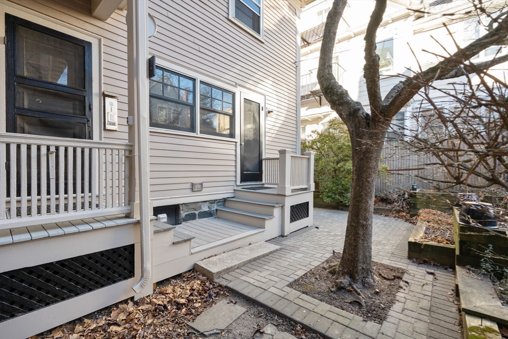 192 Upland Road Cambridge, MA 02140 - Photo 25 of 29 a front view of a house with a yard