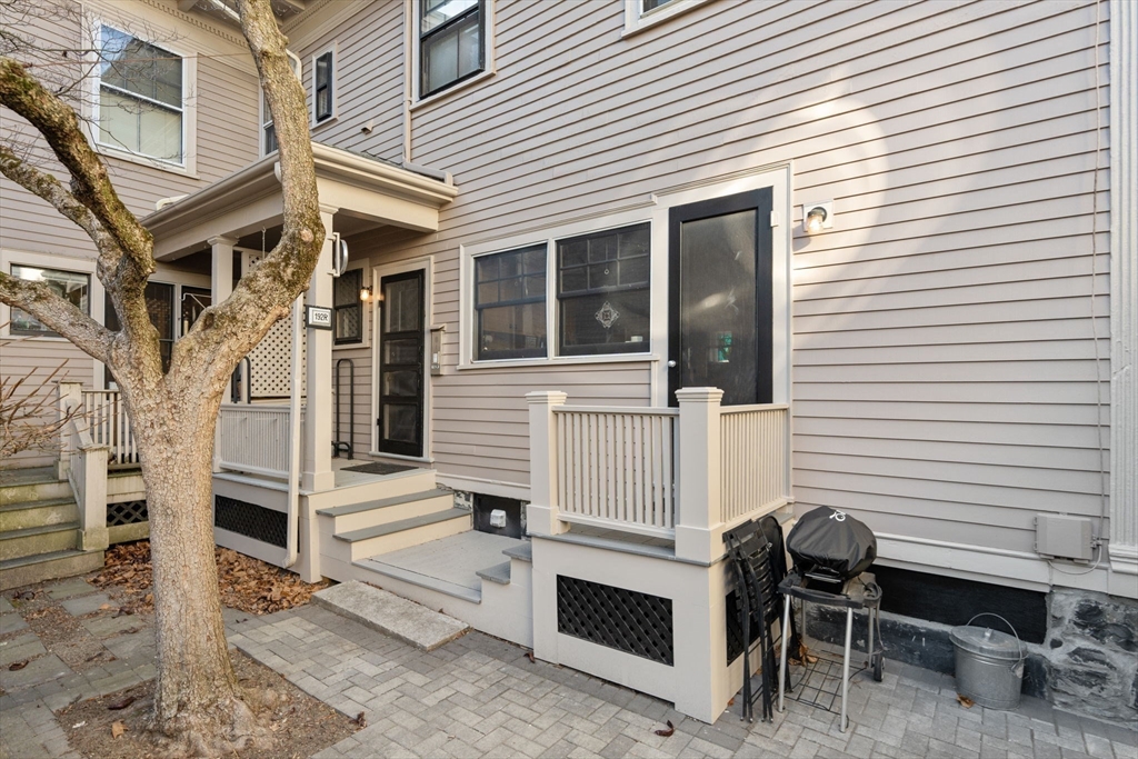 192 Upland Road Cambridge, MA 02140 - Photo 28 of 29 a view of a house with a table and chairs