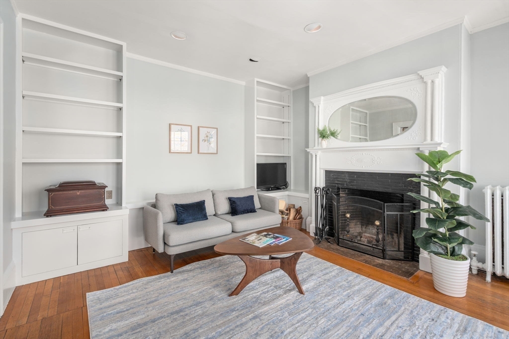 192 Upland Road Cambridge, MA 02140 - Photo 5 of 29 a living room with furniture and a fireplace