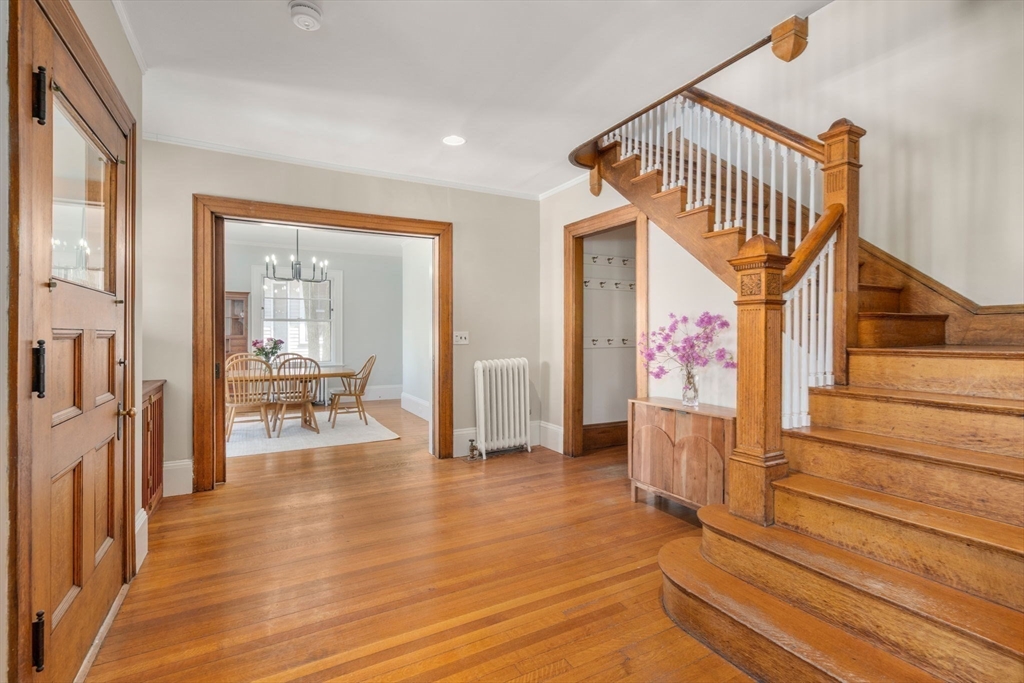 192 Upland Road Cambridge, MA 02140 - Photo 8 of 29 a view of a hallway view with wooden floor and staircase