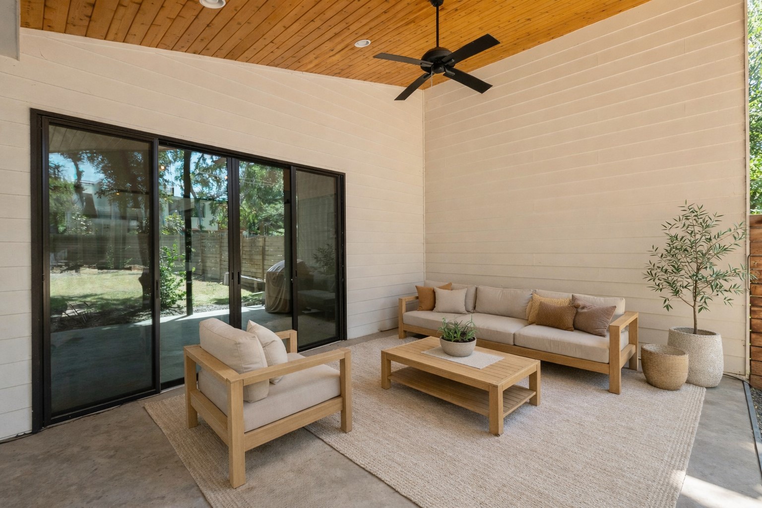 1005 Cardinal Lane, Unit B Austin, TX 78704 - Photo 13 of 17 a living room with furniture and a floor to ceiling window