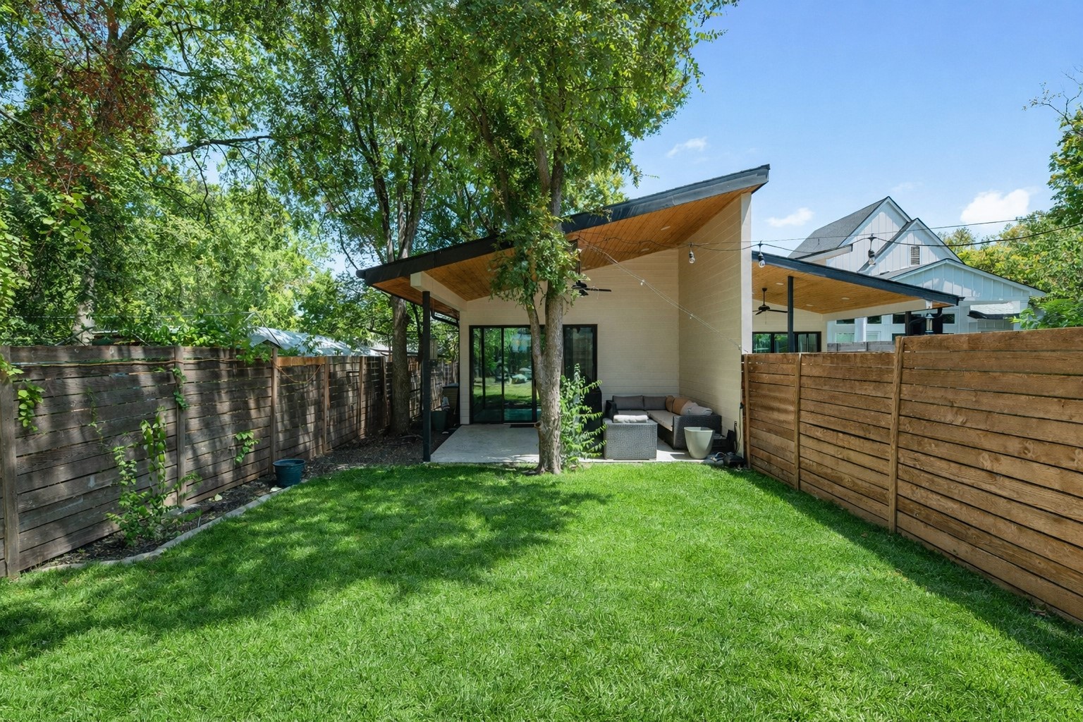 1005 Cardinal Lane, Unit B Austin, TX 78704 - Photo 16 of 17 a view of a house with backyard and sitting area