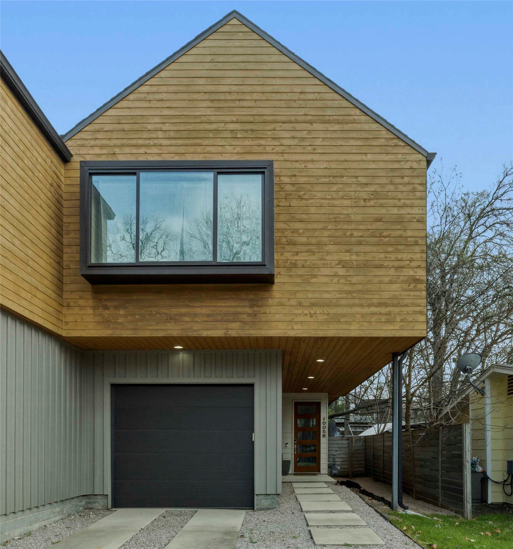 1005 Cardinal Lane, Unit B Austin, TX 78704 - Photo 17 of 17 a front view of a house with garden