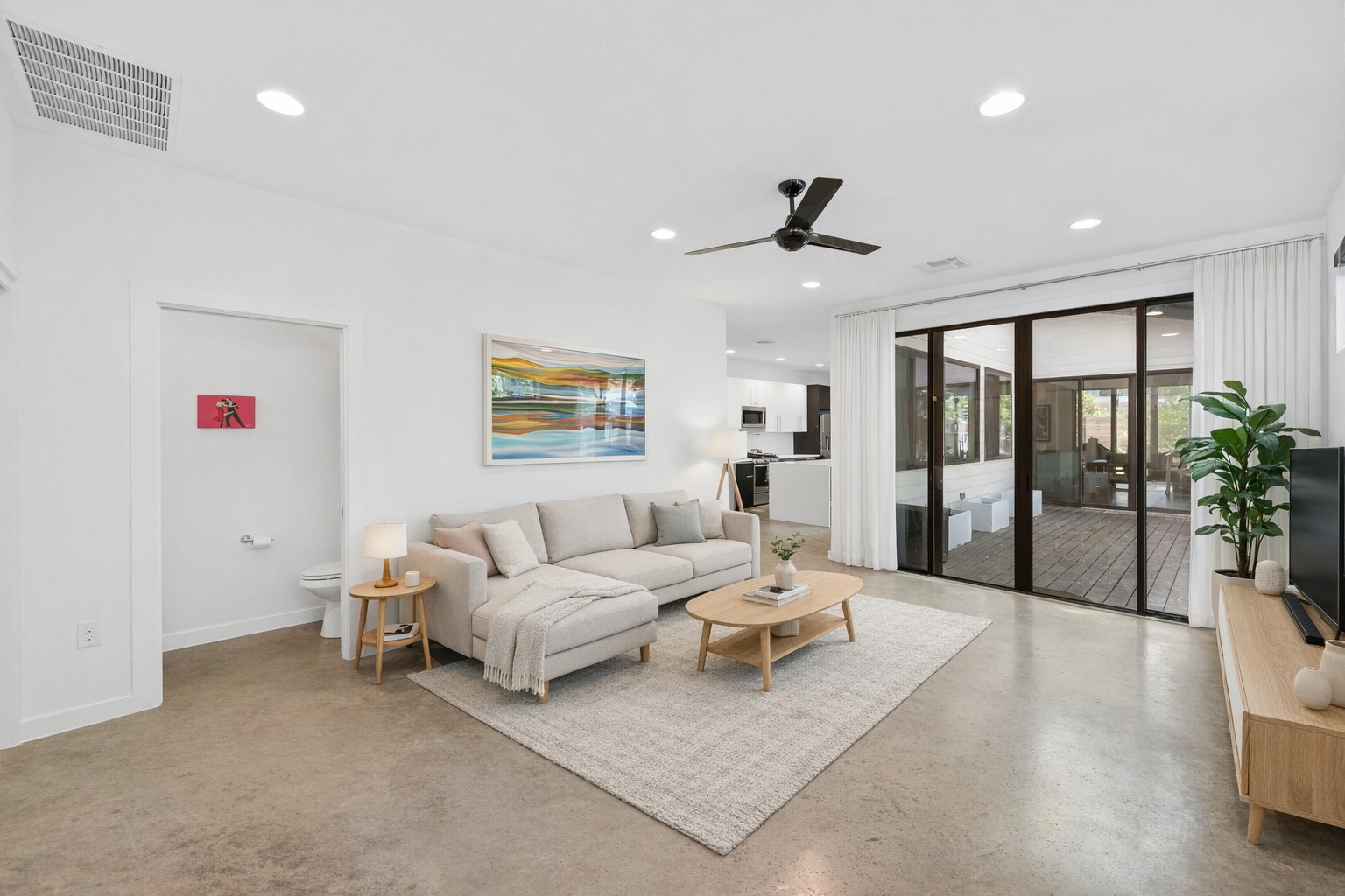 1005 Cardinal Lane, Unit B Austin, TX 78704 - Photo 2 of 17 a living room with furniture and a large window