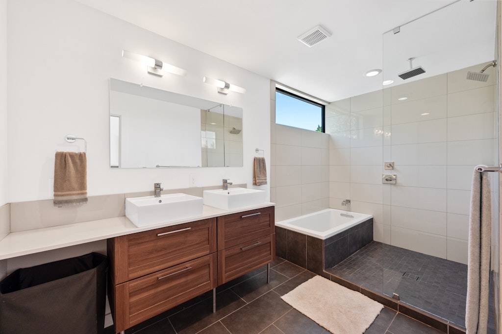1005 Cardinal Lane, Unit B Austin, TX 78704 - Photo 7 of 17 a bathroom with a double vanity sink and mirror