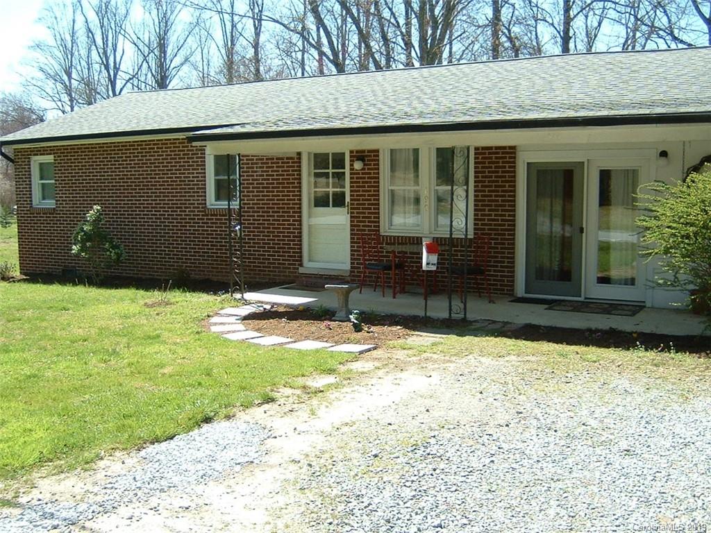 190 Brickyard Road Etowah, NC 28729 - Photo 2 of 15 a backyard of a house with yard and outdoor seating