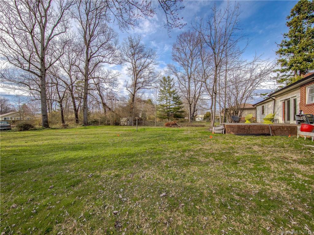 190 Brickyard Road Etowah, NC 28729 - Photo 12 of 15 a view of a house with a big yard