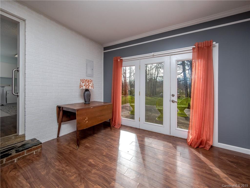 190 Brickyard Road Etowah, NC 28729 - Photo 14 of 15 a bedroom with wooden floor and a window