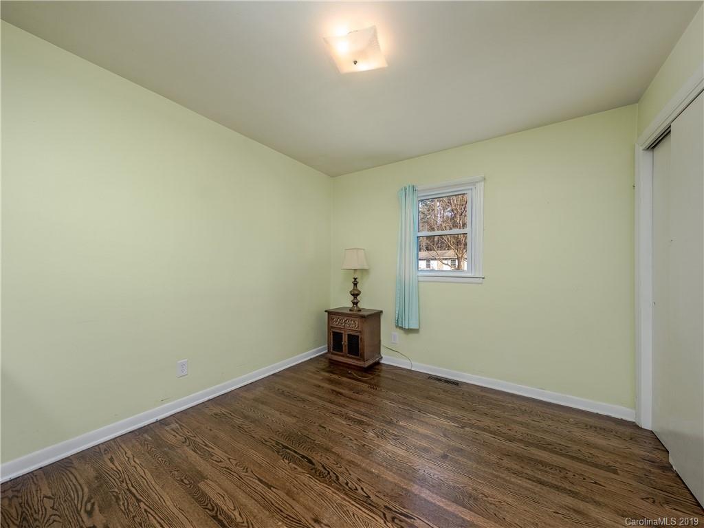 190 Brickyard Road Etowah, NC 28729 - Photo 8 of 15 a view of a room with wooden floor and furniture