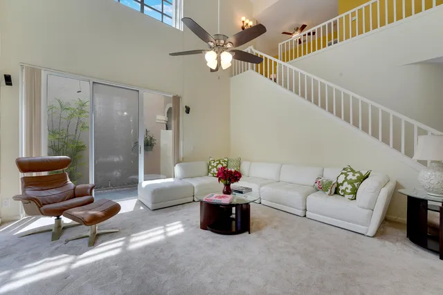 a living room with furniture and white walls