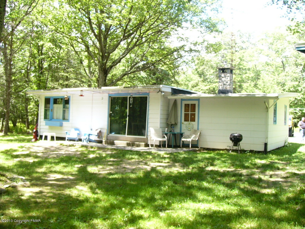 Lake Road Canadensis, PA 18325 - Photo 2 of 10 a backyard of a house with table and chairs