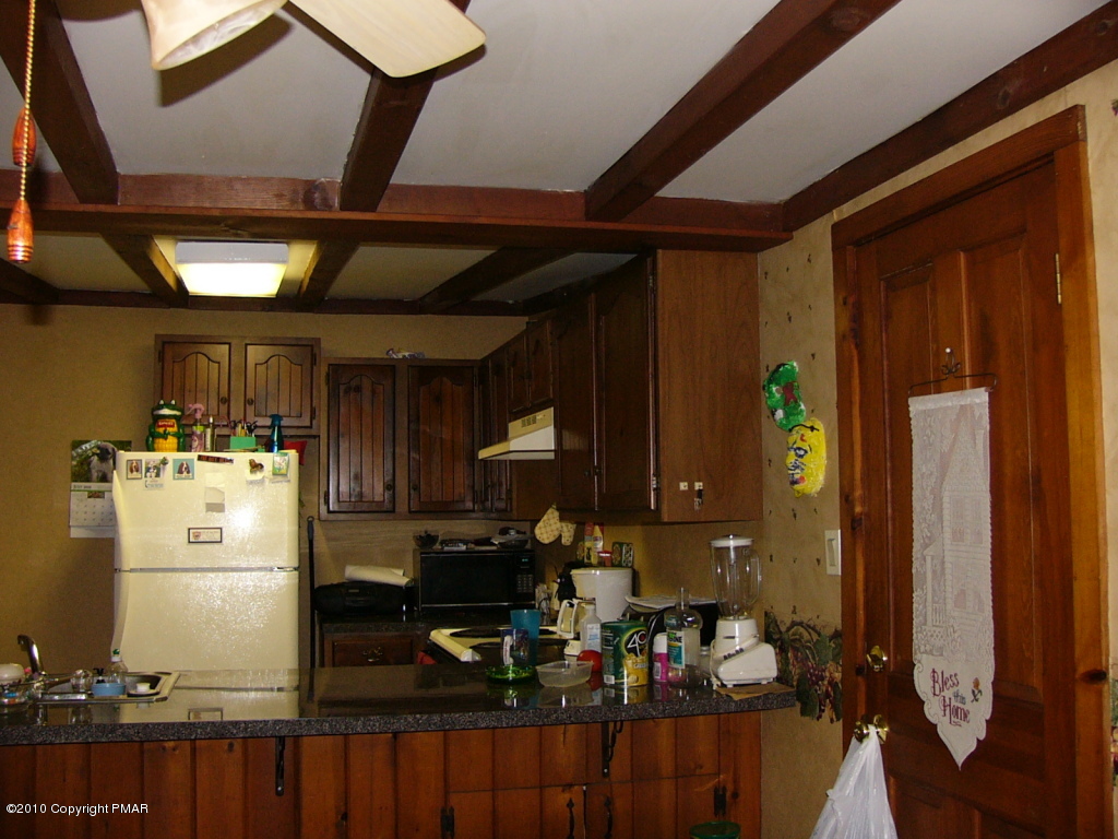 Lake Road Canadensis, PA 18325 - Photo 3 of 10 a kitchen with refrigerator and cabinets