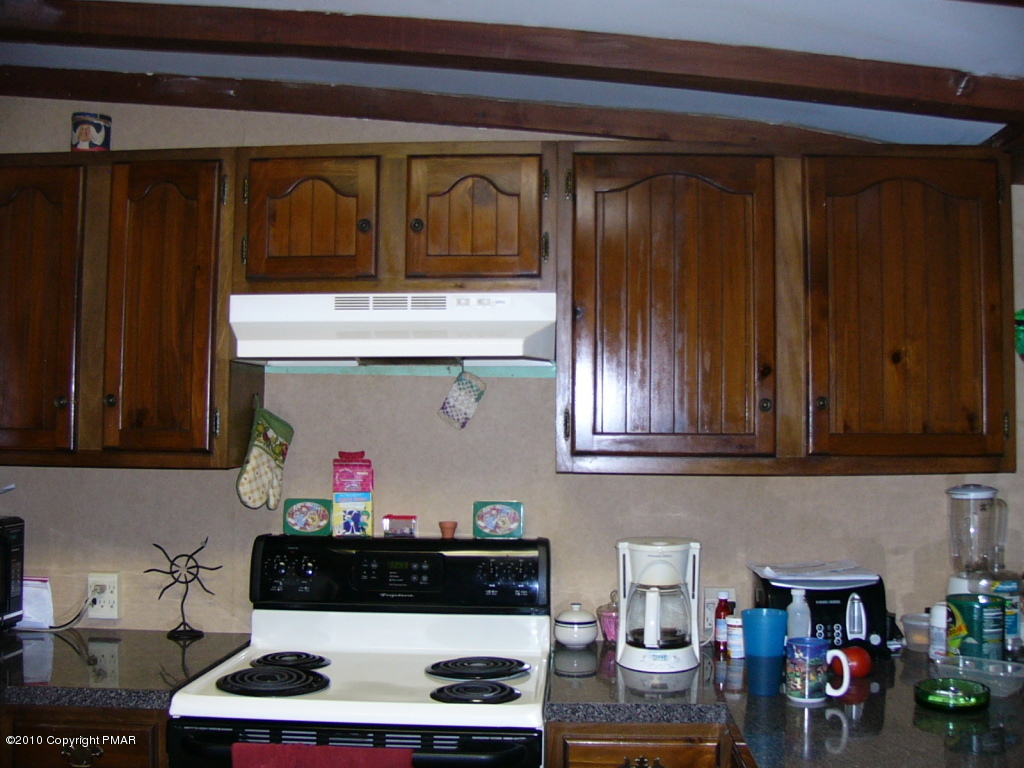Lake Road Canadensis, PA 18325 - Photo 5 of 10 a kitchen with lots of clutter and cabinets
