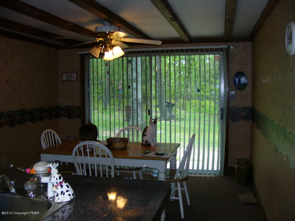 Lake Road Canadensis, PA 18325 - Photo 6 of 10 a view of a dining room with furniture window and outside view