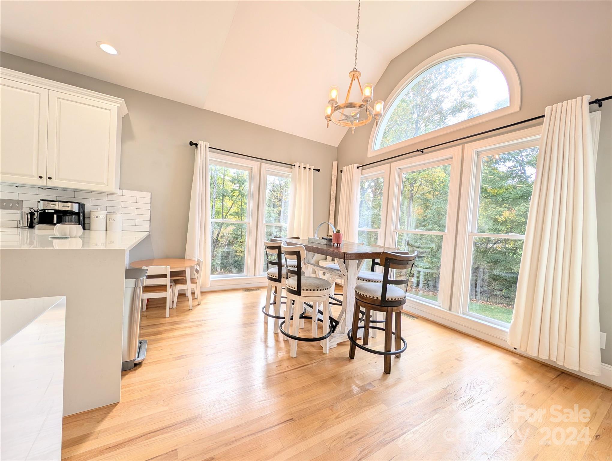 640 Amberly Crossing Fort Mill, SC 29708 - Photo 11 of 45 a living room with furniture a fireplace and large windows