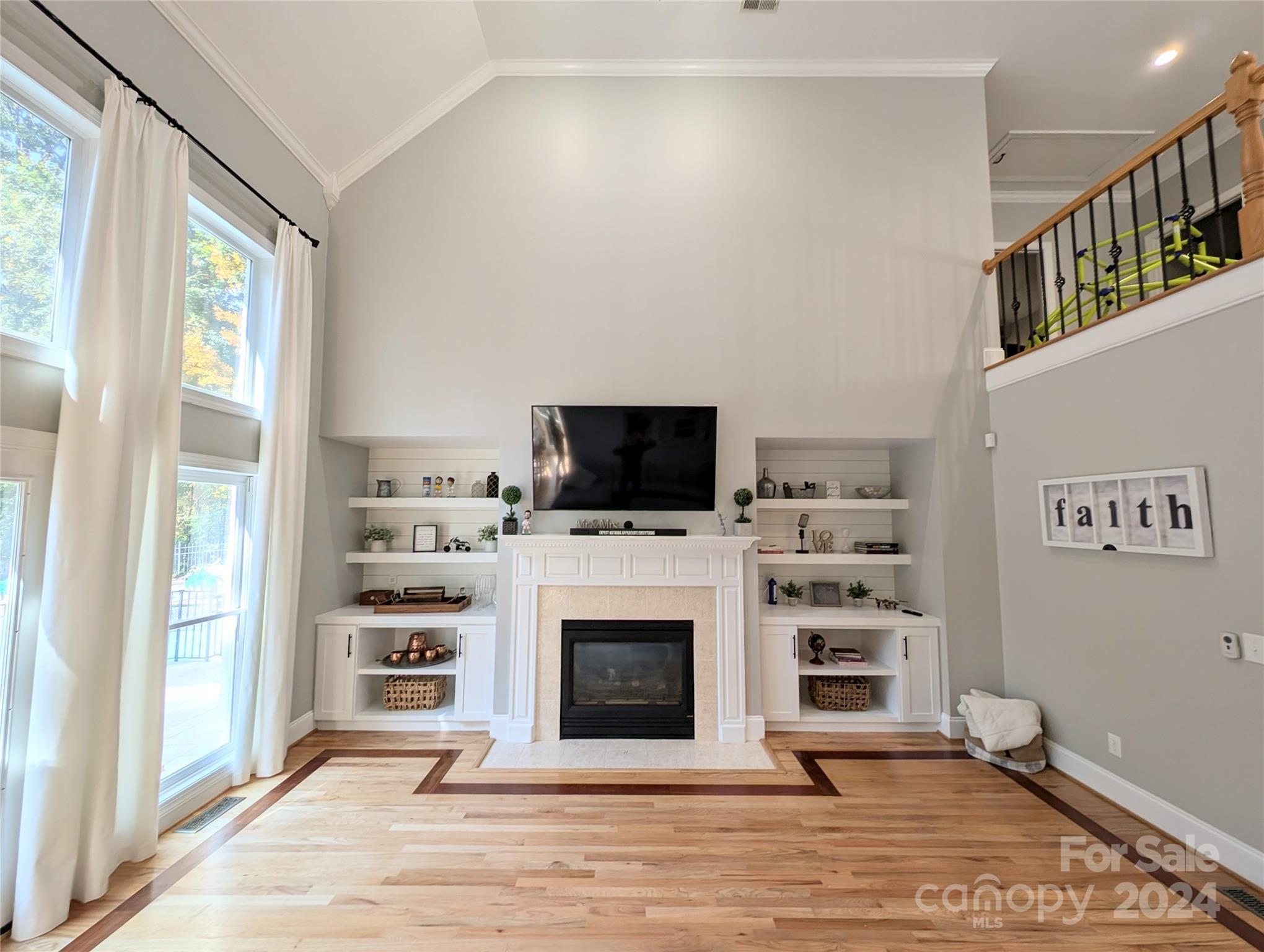 640 Amberly Crossing Fort Mill, SC 29708 - Photo 15 of 45 a living room with furniture a flat screen tv and a fireplace