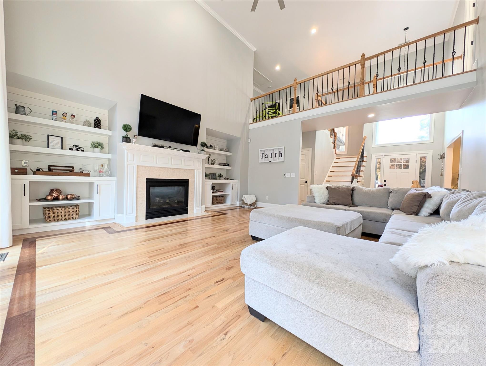 640 Amberly Crossing Fort Mill, SC 29708 - Photo 16 of 45 a living room with furniture a flat screen tv and a fireplace