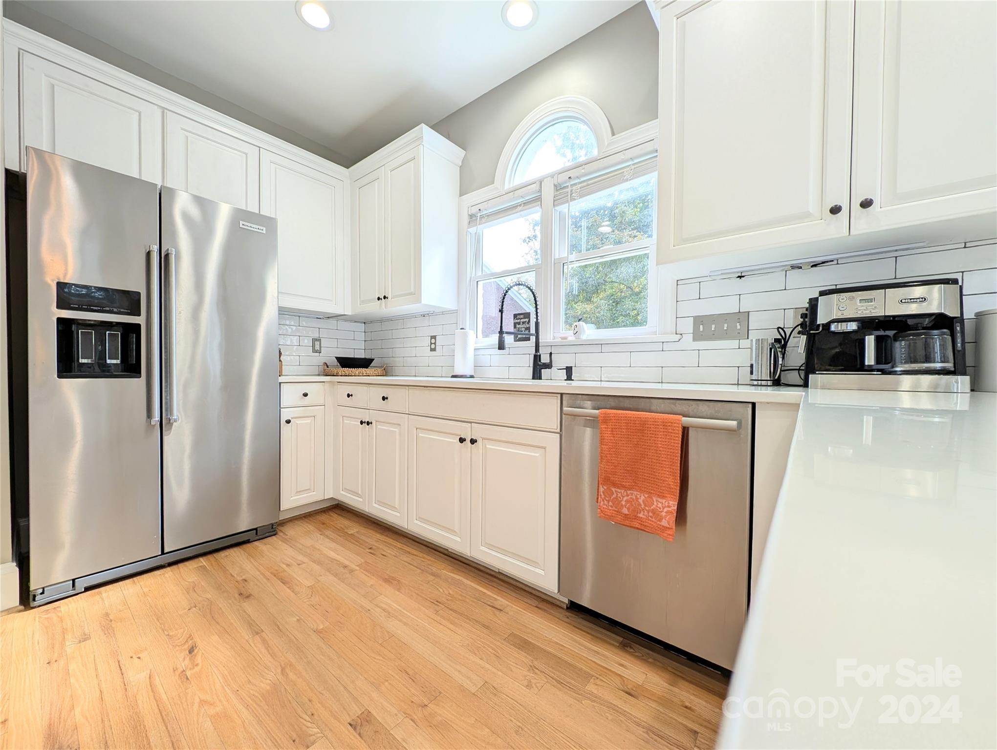 640 Amberly Crossing Fort Mill, SC 29708 - Photo 8 of 45 a kitchen with white cabinets and white appliances
