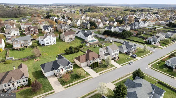 an aerial view of residential houses with outdoor space
