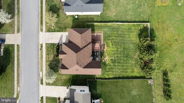 aerial view of a house with a yard