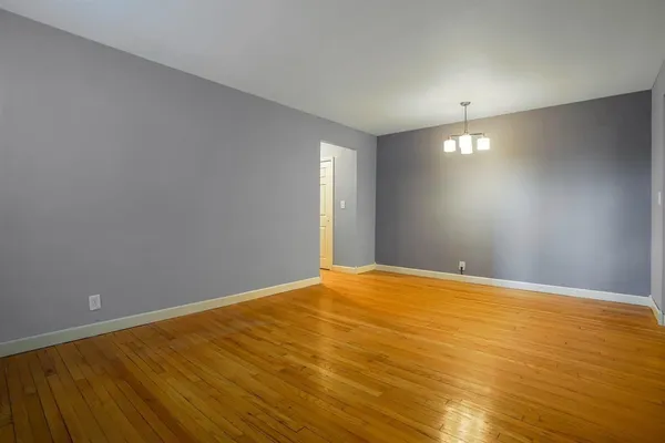 an empty room with a empty space and window