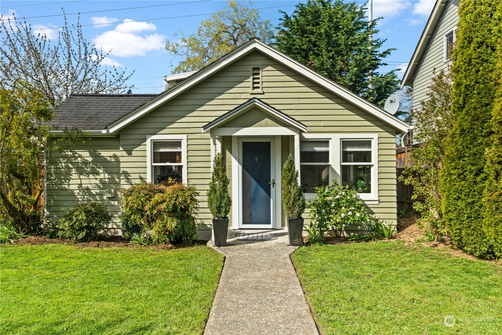 a front view of a house with garden