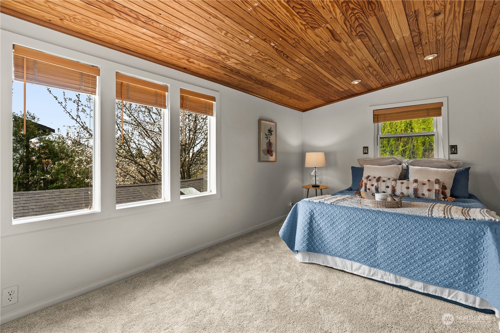 9721 Fremont Avenue North Seattle, WA 98103 - Photo 13 of 27 a bedroom with furniture and a window