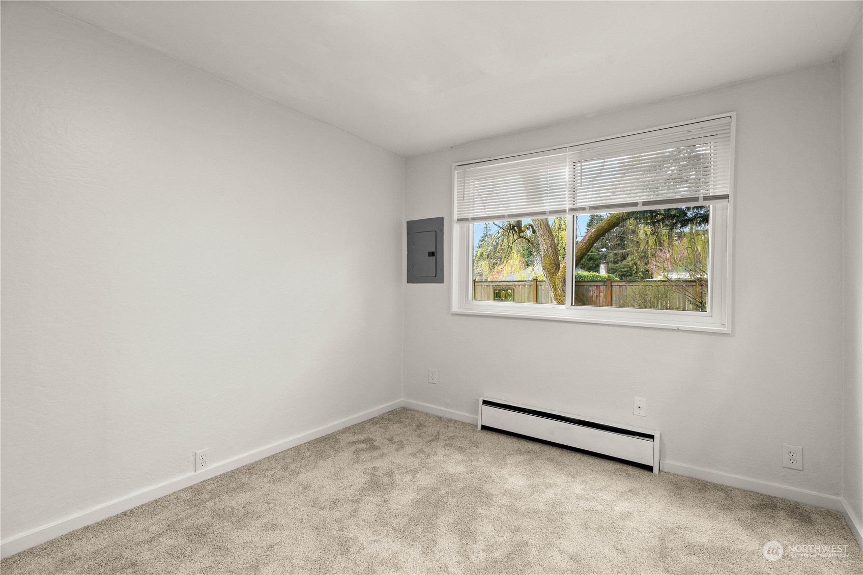 9721 Fremont Avenue North Seattle, WA 98103 - Photo 17 of 27 an empty room with a window