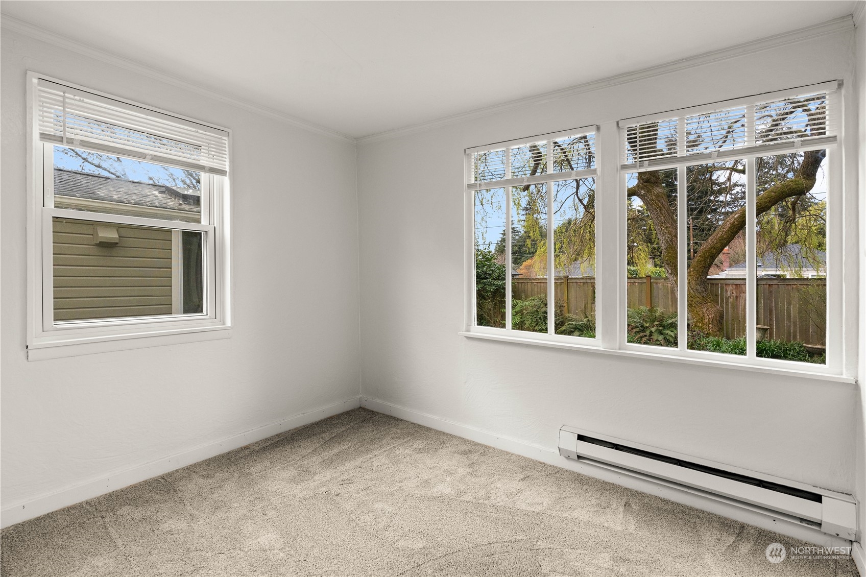 9721 Fremont Avenue North Seattle, WA 98103 - Photo 18 of 27 a view of an empty room with a window