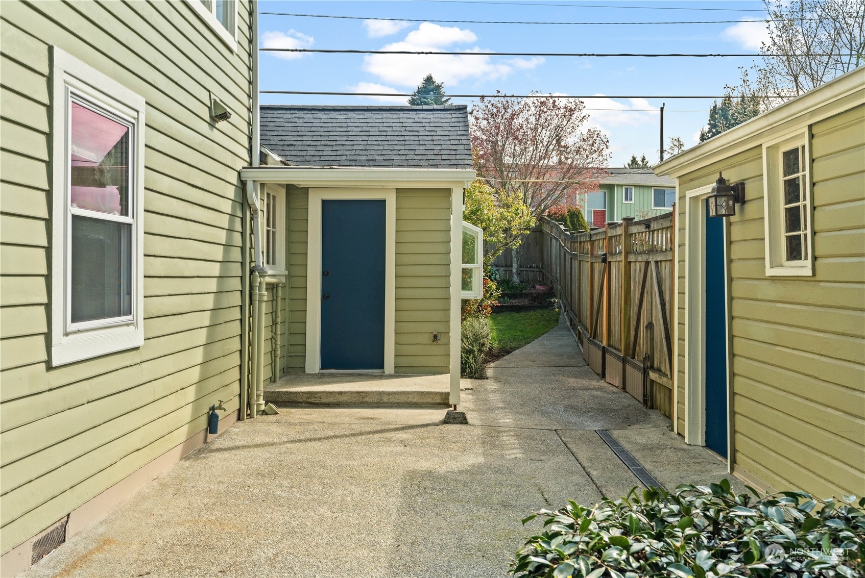 9721 Fremont Avenue North Seattle, WA 98103 - Photo 20 of 27 a view of a house with wooden fence