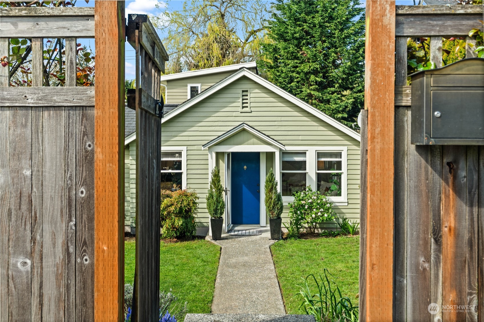 9721 Fremont Avenue North Seattle, WA 98103 - Photo 2 of 27 a view of a house with garden