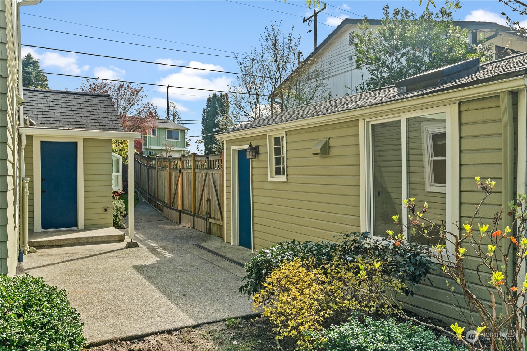9721 Fremont Avenue North Seattle, WA 98103 - Photo 21 of 27 a view of a house with a garden