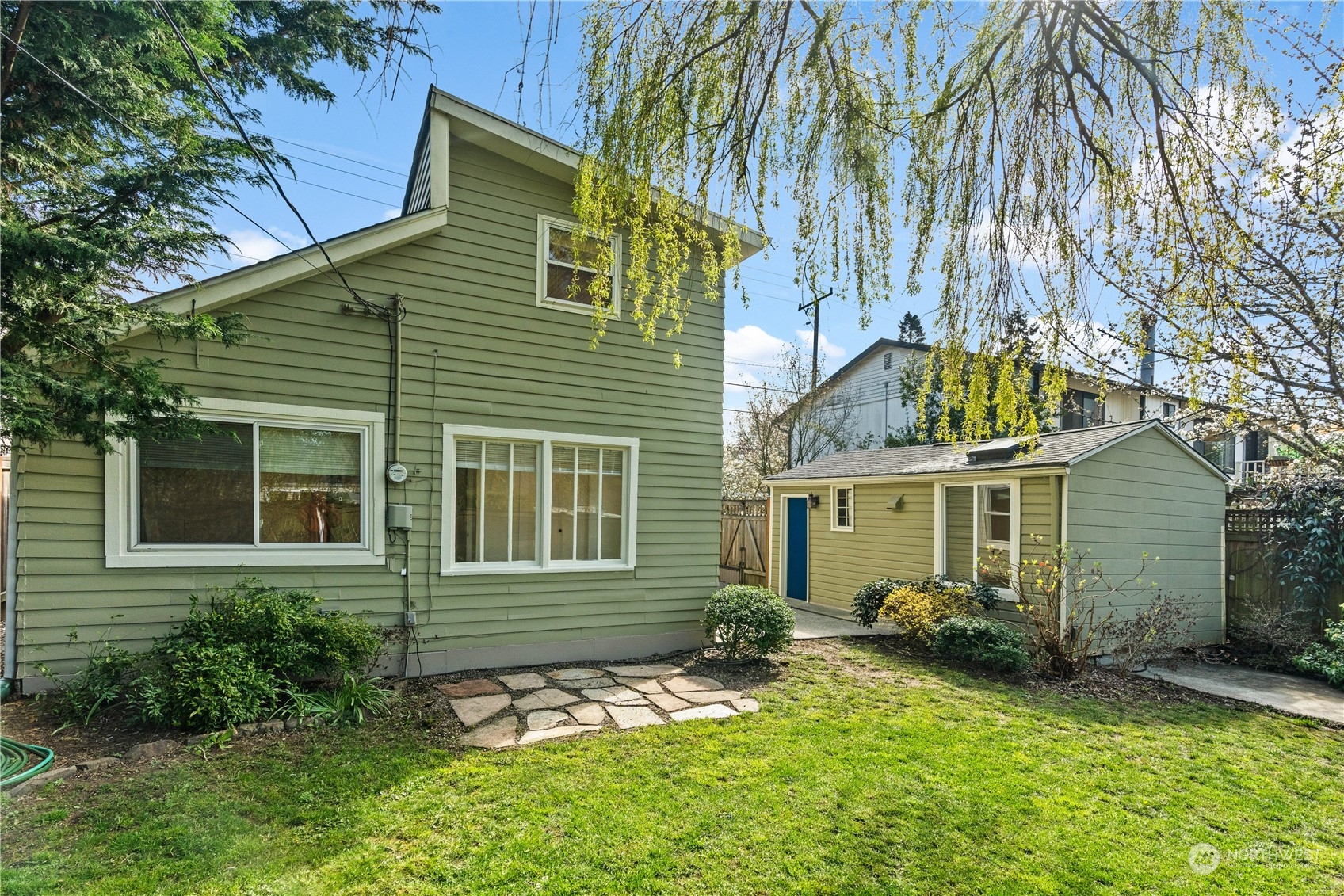 9721 Fremont Avenue North Seattle, WA 98103 - Photo 23 of 27 front view of a house with a yard