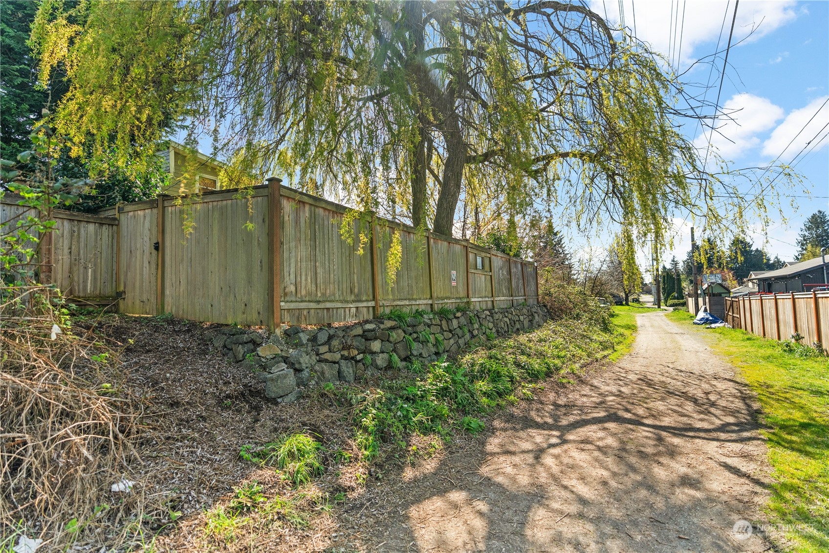 9721 Fremont Avenue North Seattle, WA 98103 - Photo 27 of 27 a backyard of a house with lots of green space