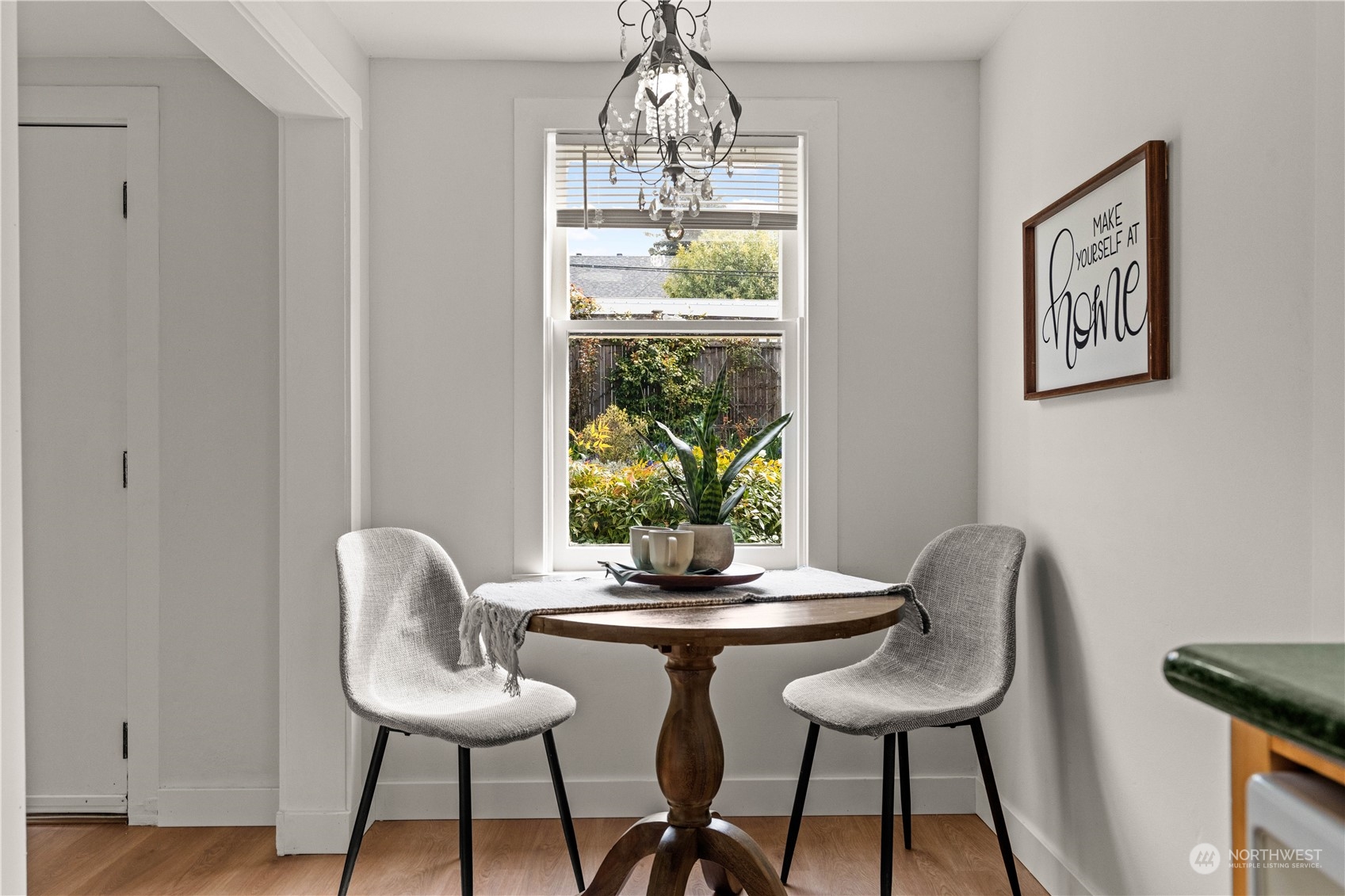 9721 Fremont Avenue North Seattle, WA 98103 - Photo 6 of 27 a dining room with furniture and window