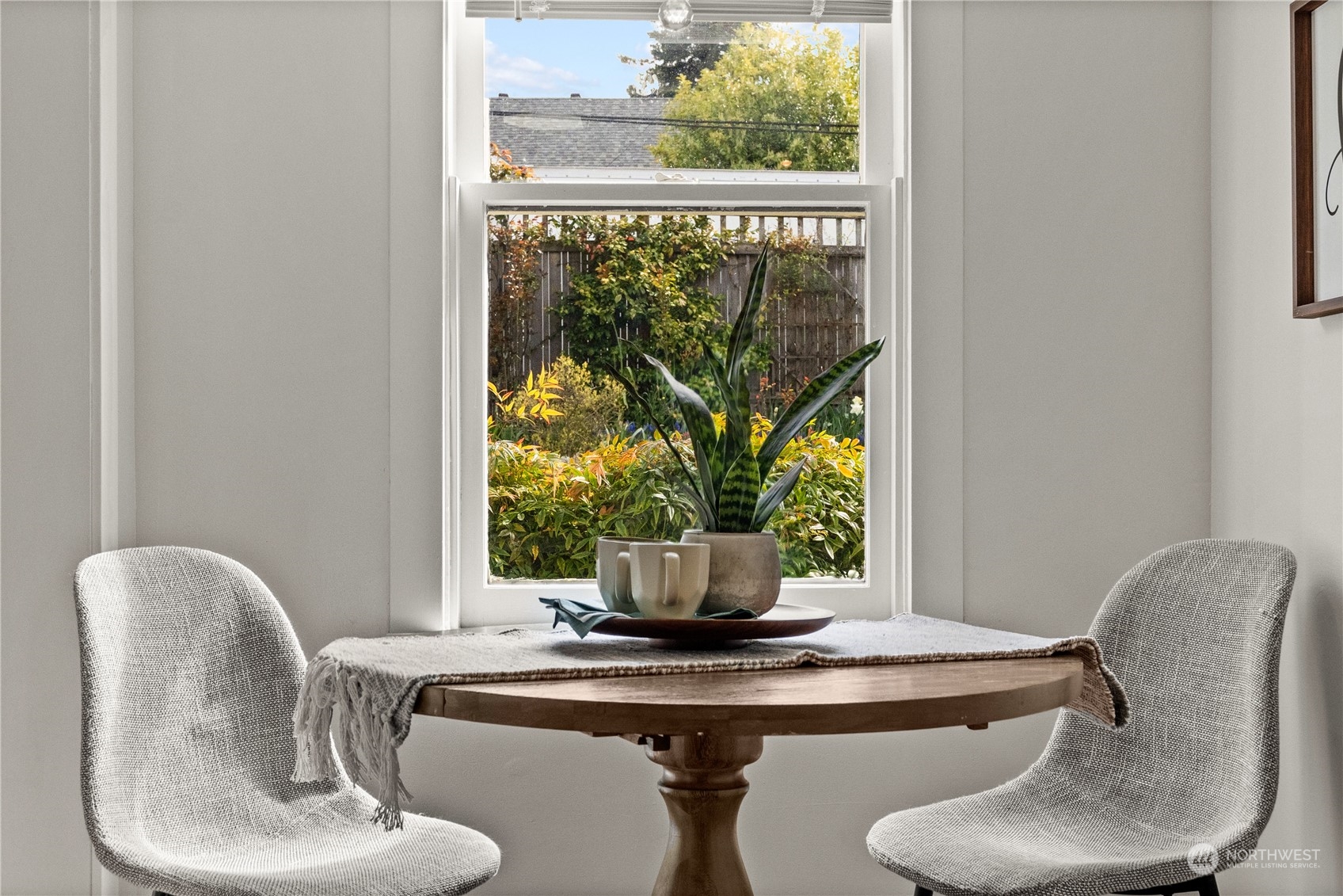 9721 Fremont Avenue North Seattle, WA 98103 - Photo 7 of 27 a dining room with furniture and window