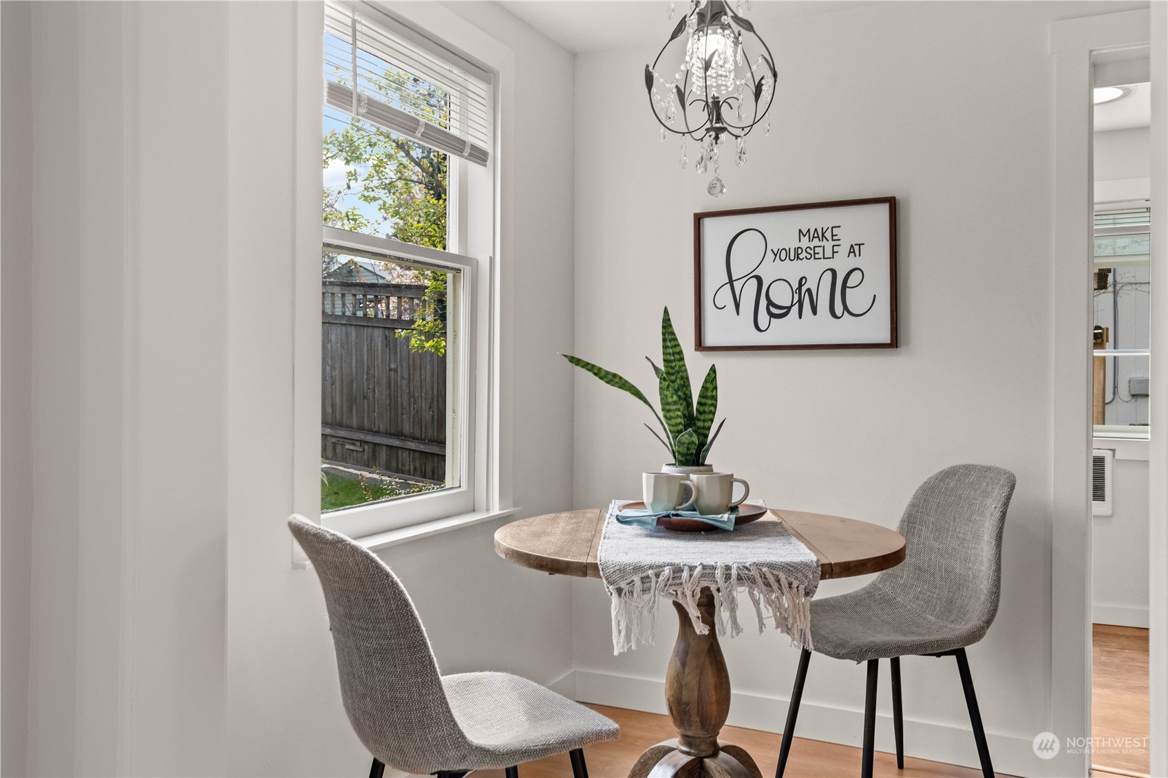 9721 Fremont Avenue North Seattle, WA 98103 - Photo 8 of 27 a view of a dining room with furniture and window