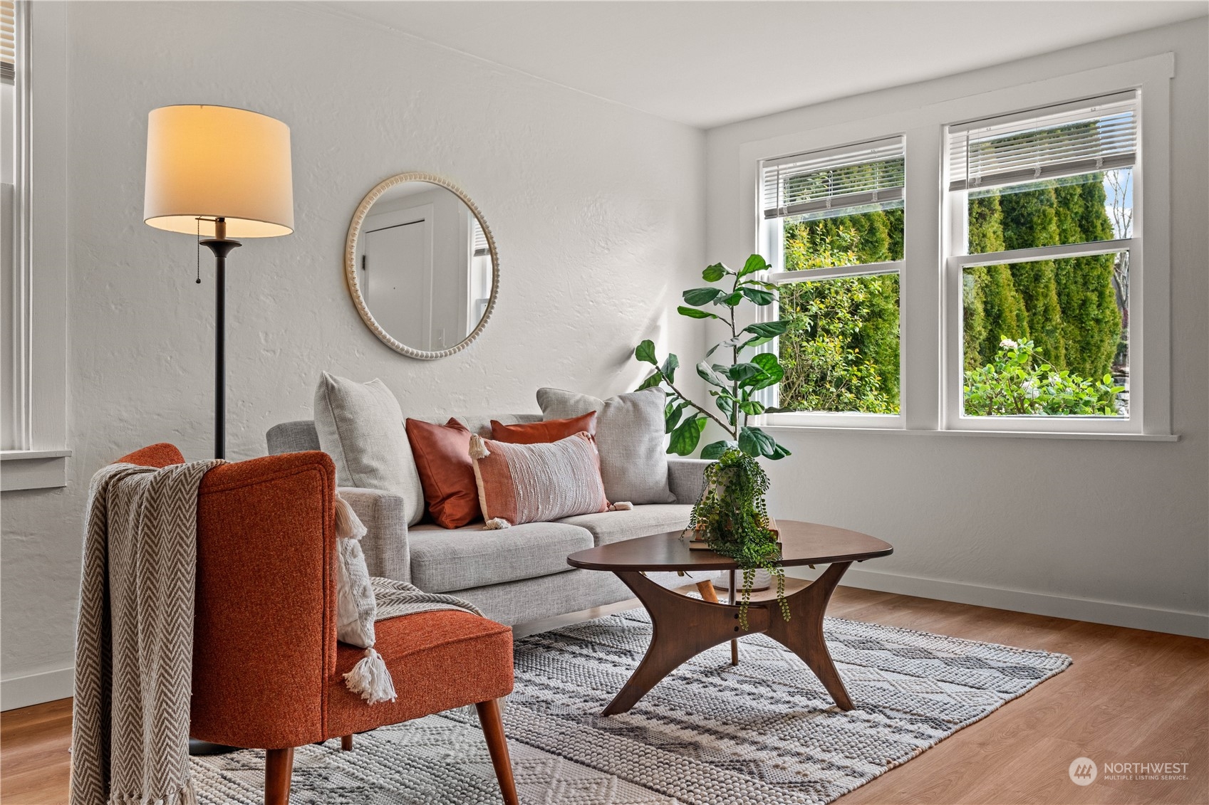 9721 Fremont Avenue North Seattle, WA 98103 - Photo 9 of 27 a living room with furniture flowerpot and window