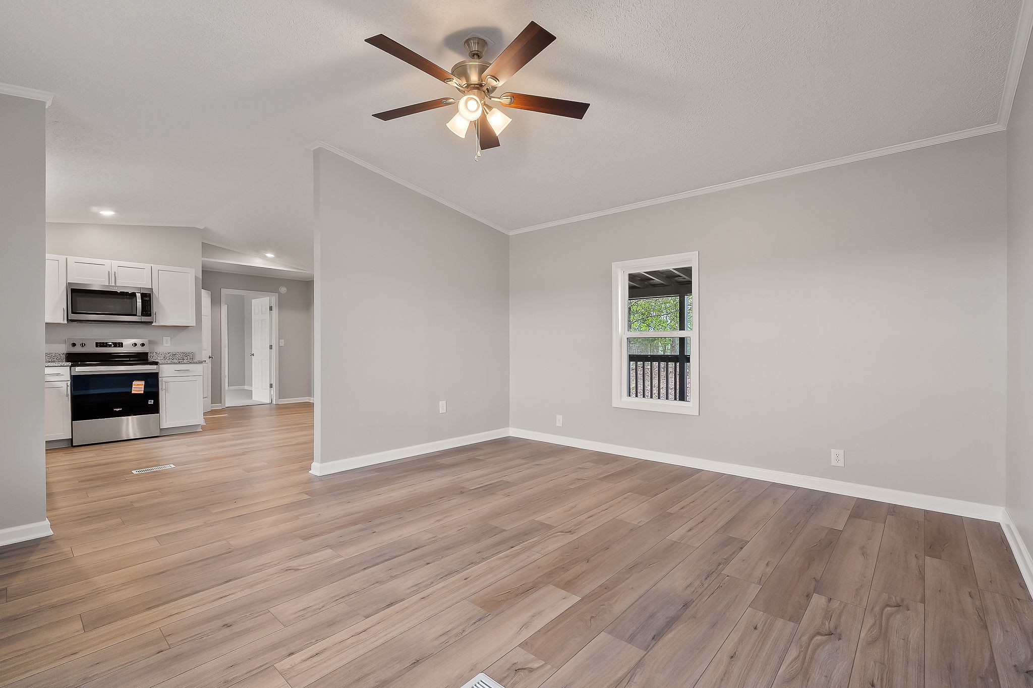 479 Old Bildad Road Smithville, TN 37166 - Photo 5 of 30 a view of an empty room with kitchen view and a window