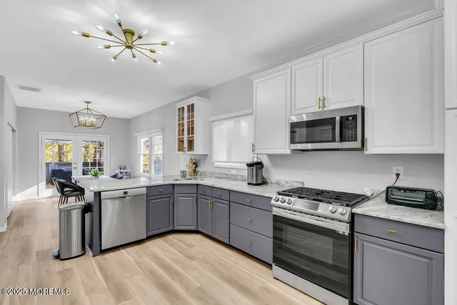 a bathroom with a bathtub a window and a shower