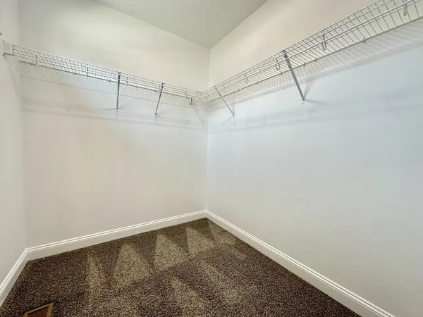 a view of a room with racks on the wall