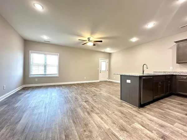 a view of a livingroom with a kitchen