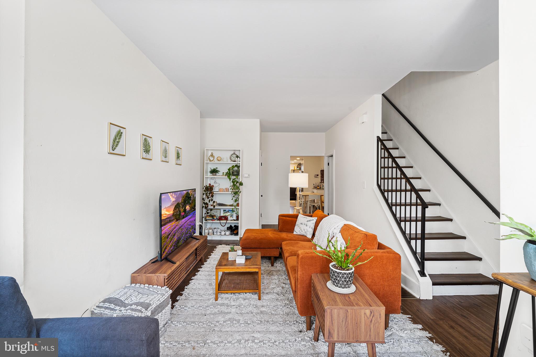 107 Master Street Philadelphia, PA 19122 - Photo 4 of 24 a living room with furniture and a wooden floor