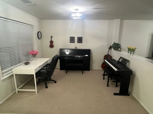 a view of a workspace with furniture