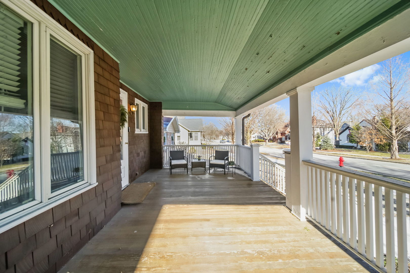 4142 Wolf Road Western Springs, IL 60558 - Photo 2 of 34 a view of a patio with dining table and chairs with wooden floor
