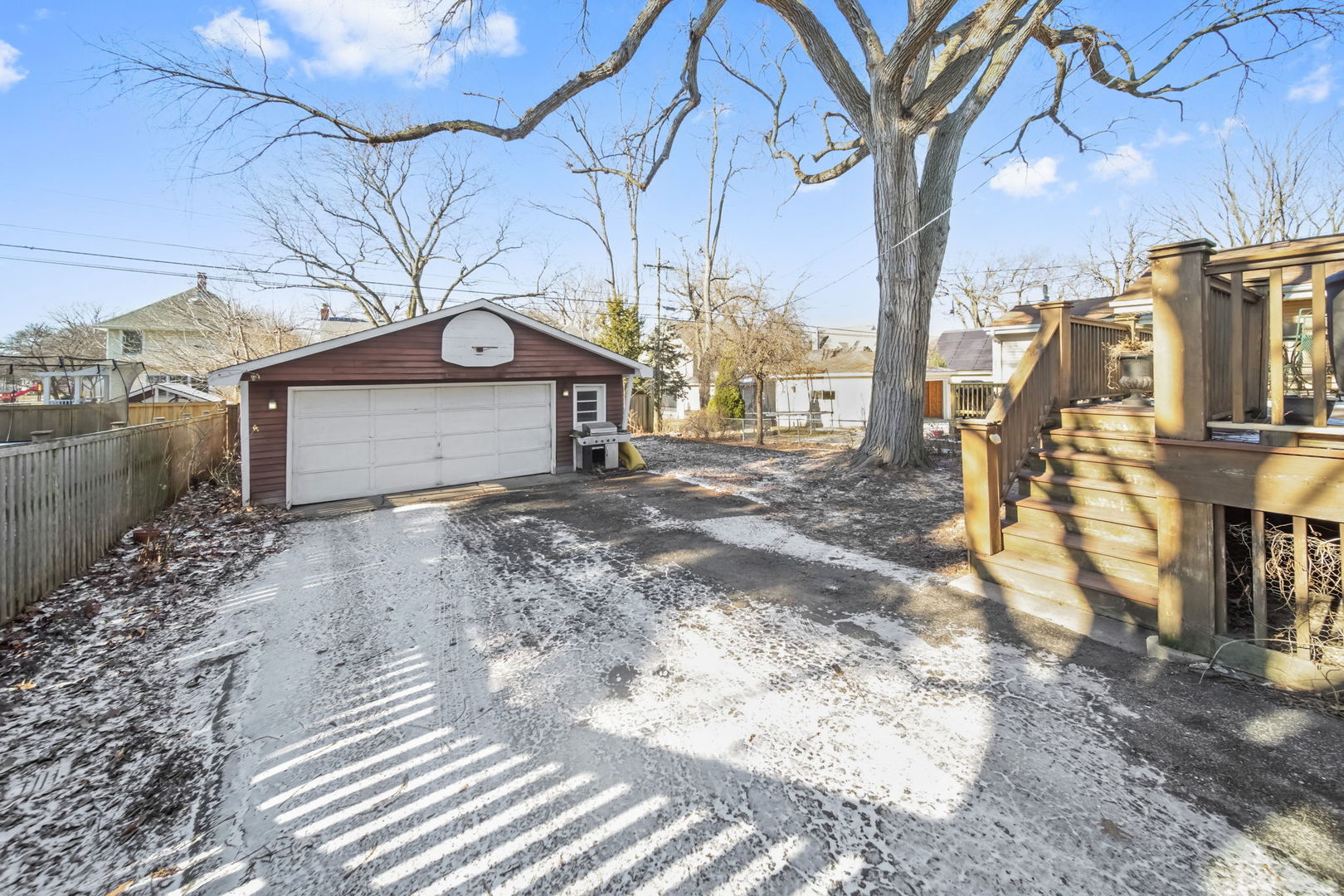 4142 Wolf Road Western Springs, IL 60558 - Photo 22 of 34 a front view of a house with a yard covered with snow