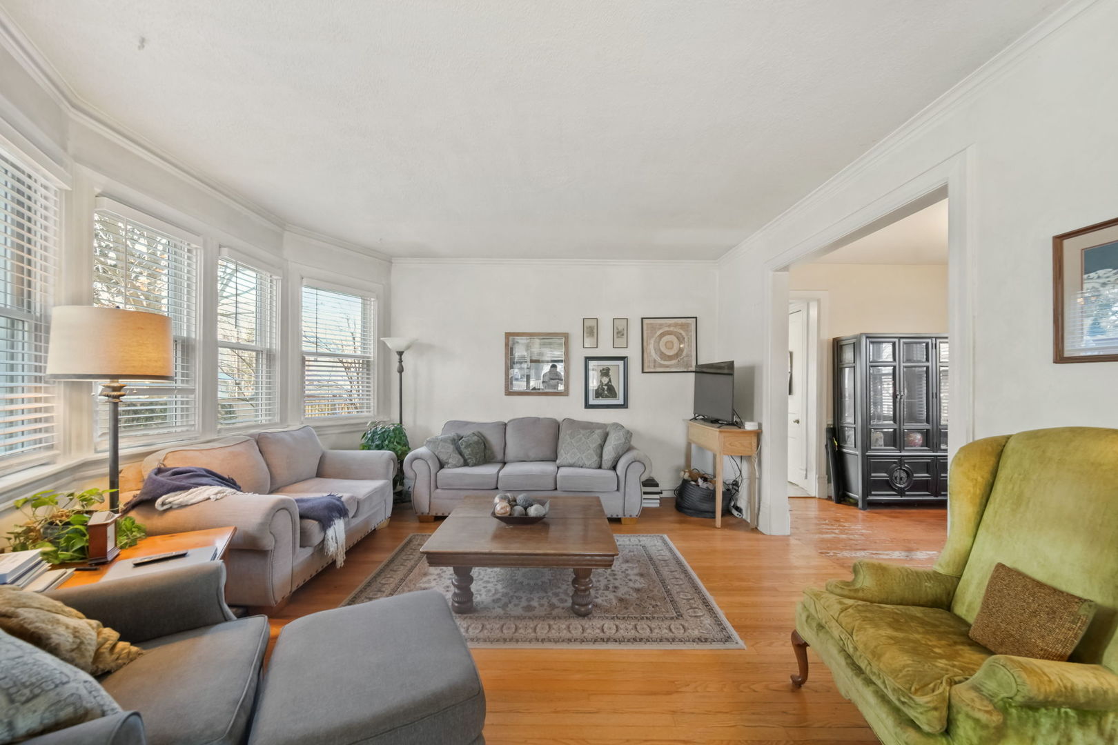4142 Wolf Road Western Springs, IL 60558 - Photo 5 of 34 a living room with furniture wooden floor and a large window
