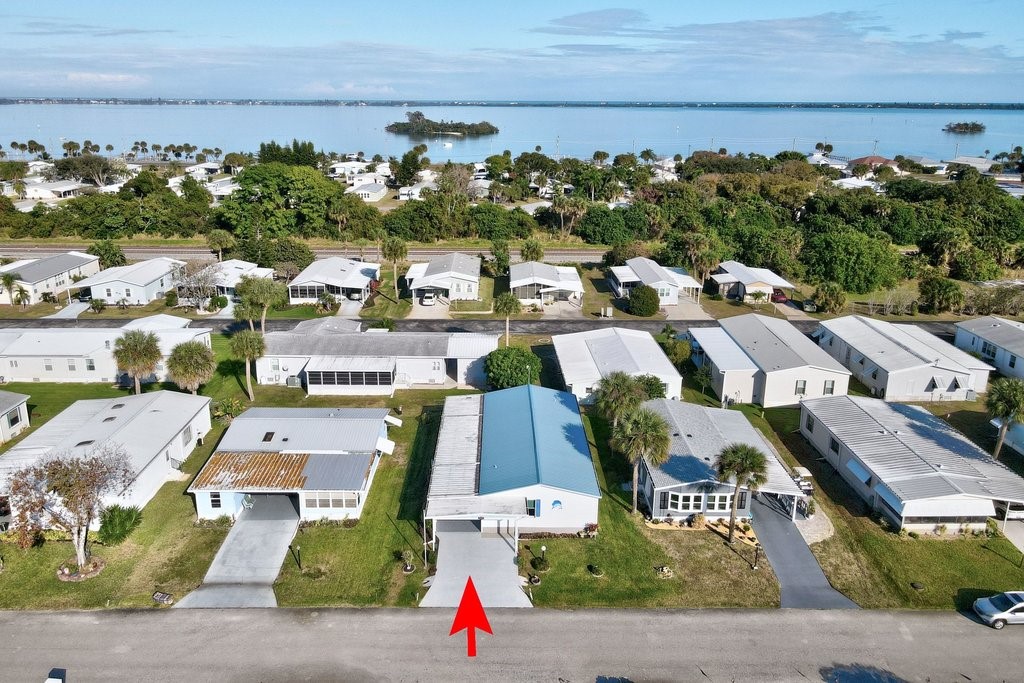 7605 Cedar Bark Road Sebastian, FL 32976 - Photo 1 of 34 an aerial view of residential houses with outdoor space
