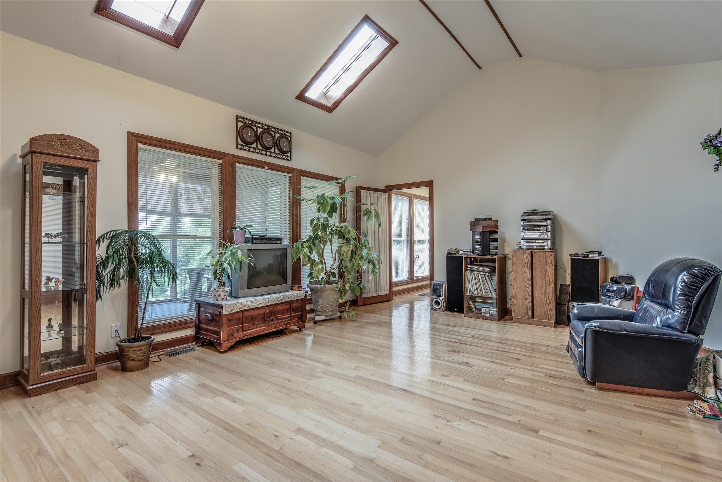 8627 Taliaferro Road Eagleville, TN 37060 - Photo 17 of 30 Want Privacy from all of the guest or family. Enjoy your evenings soaking in some quite time in the den. Plenty of light with the sky lights and windows over looking the back yard