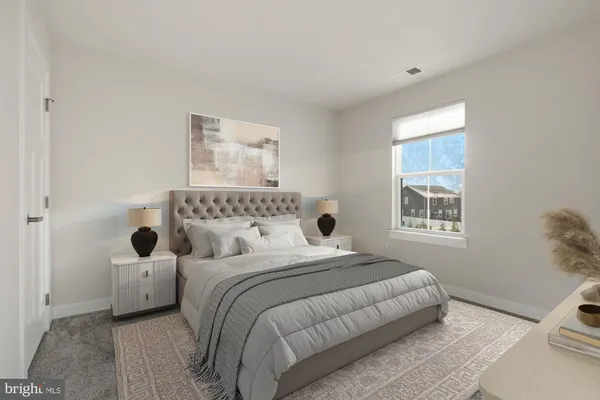 a bedroom with a bed and a couch